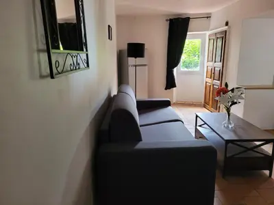 Télévision ou salle de divertissement dans l'établissement La maison de corse