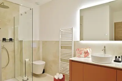 Salle de bains dans l'établissement Résidence Les volets rouges - Duplex de standing avec piscine
