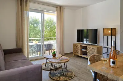 Télévision ou salle de divertissement dans l'établissement Residence Des Îles