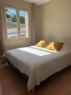 Un ou plusieurs lits dans un hébergement de l'établissement Studio Saint Florent