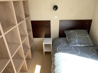 Un ou plusieurs lits dans un hébergement de l'établissement Mobil- home à Calenzana