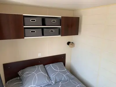 Un ou plusieurs lits dans un hébergement de l'établissement Mobil- home à Calenzana