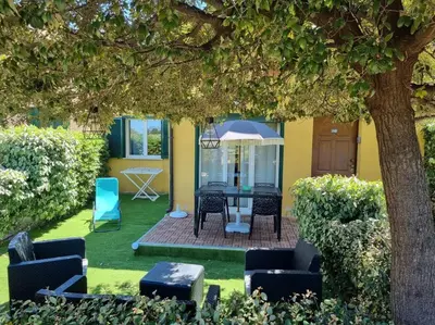 Jardin de l'établissement Maison en duplex dans résidence à 400m de la mer