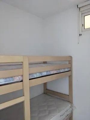 Un ou plusieurs lits dans un hébergement de l'établissement Vue sur mer cala Di sognu