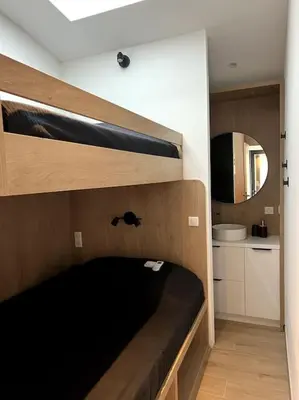 Un ou plusieurs lits dans un hébergement de l'établissement Maison en bord de mer