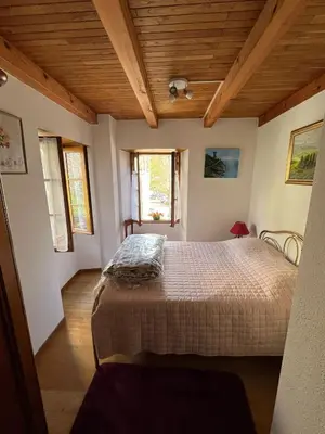 Un ou plusieurs lits dans un hébergement de l'établissement Maison de village