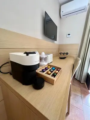 Télévision ou salle de divertissement dans l'établissement Studio confortable avec piscine