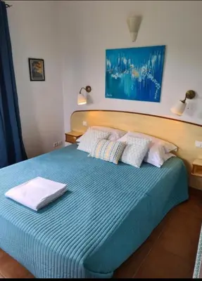 Un ou plusieurs lits dans un hébergement de l'établissement Vistamare Locations avec Piscine saint florent