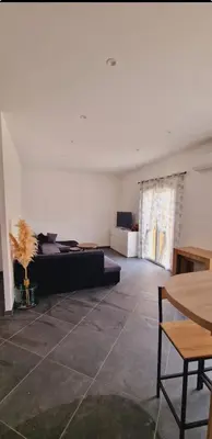 Coin salon dans l'établissement Maison Vacance Proche De Calvi
