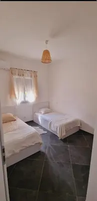 Un ou plusieurs lits dans un hébergement de l'établissement Maison Vacance Proche De Calvi