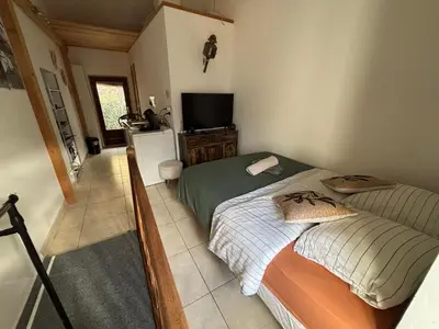 Un ou plusieurs lits dans un hébergement de l'établissement Appartement maison de village à Ota-Porto