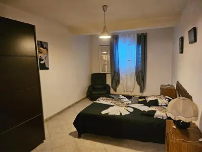 Un ou plusieurs lits dans un hébergement de l'établissement Villa des fleurs