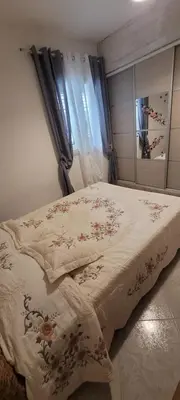 Un ou plusieurs lits dans un hébergement de l'établissement Villa des fleurs