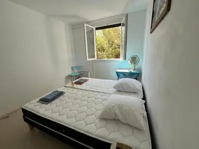 Un ou plusieurs lits dans un hébergement de l'établissement Appartement vintage Bastia - MAGNIFIQUE VUE !