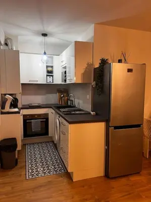 Cuisine ou kitchenette dans l'établissement CASA NINA FURIANI CORSE Appartement en résidence