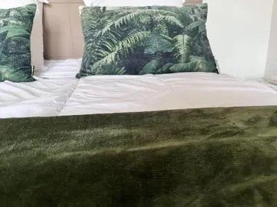 Un ou plusieurs lits dans un hébergement de l'établissement CASA NINA FURIANI CORSE Appartement en résidence