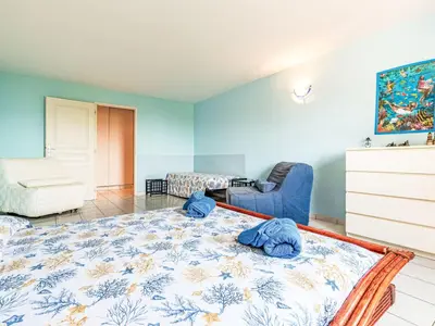 Un ou plusieurs lits dans un hébergement de l'établissement Apartment Giulia I by Interhome