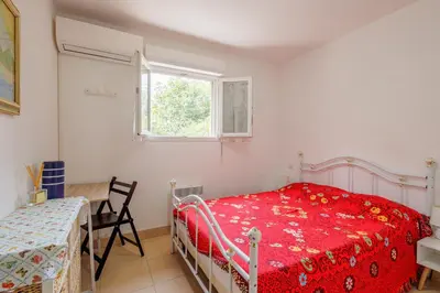 Un ou plusieurs lits dans un hébergement de l'établissement Jaso - Maison à 5min de la plage
