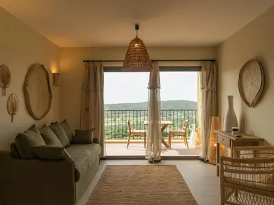Coin salon dans l'établissement Résidence & Villas Oradoro - Proche Île Rousse