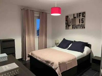 Un ou plusieurs lits dans un hébergement de l'établissement Appartement cosy avec vue mer et parking Bastia