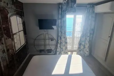 Un ou plusieurs lits dans un hébergement de l'établissement Appartement Bord de plage Vue mer