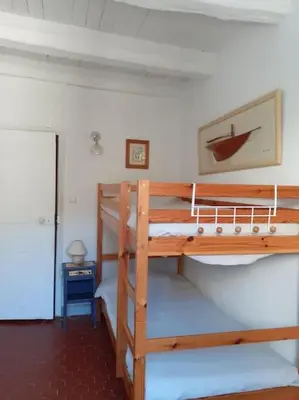 Un ou plusieurs lits dans un hébergement de l'établissement La maison du pêcheur à Porticciolo Cap-Corse