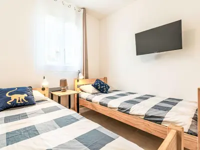 Un ou plusieurs lits dans un hébergement de l'établissement Apartment Mido by Interhome