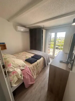 Un ou plusieurs lits dans un hébergement de l'établissement Maison bord de mer