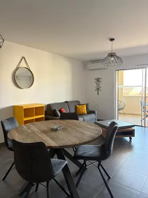 Coin salon dans l'établissement Appartement Rossignol