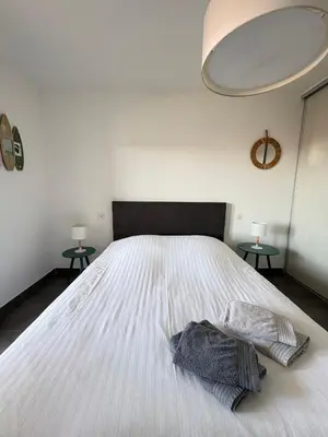 Un ou plusieurs lits dans un hébergement de l'établissement Appartement Rossignol