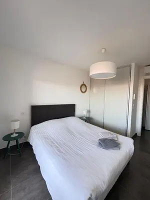 Un ou plusieurs lits dans un hébergement de l'établissement Appartement Rossignol