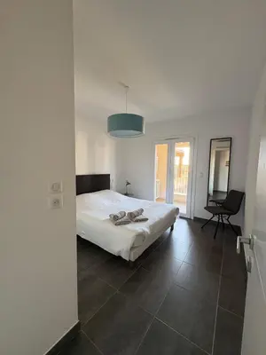 Un ou plusieurs lits dans un hébergement de l'établissement Appartement Rossignol