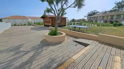 Jardin de l'établissement Appartement avec piscine à 2 pas de la plage