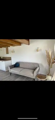 Coin salon dans l'établissement Appartement Oriana