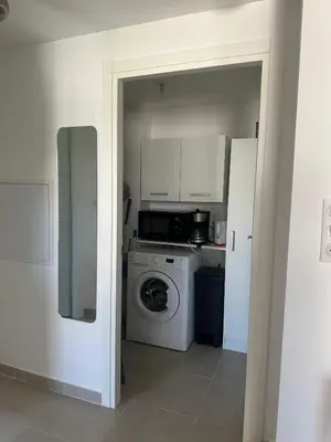 Cuisine ou kitchenette dans l'établissement Appartement HARMONIE