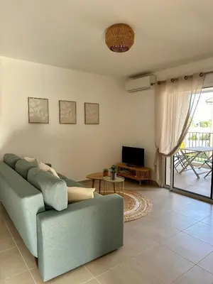 Coin salon dans l'établissement Appartement HARMONIE