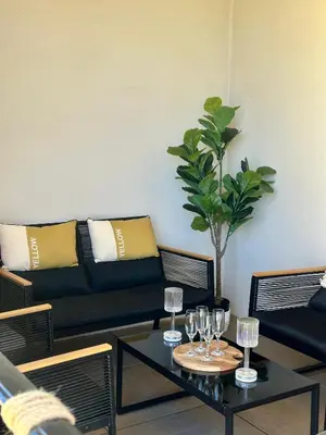 Coin salon dans l'établissement Appartement HARMONIE