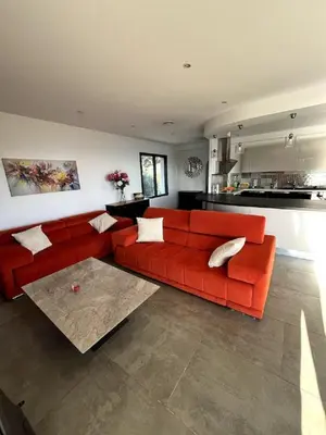 Coin salon dans l'établissement Villa avec piscine vue mer et montagne