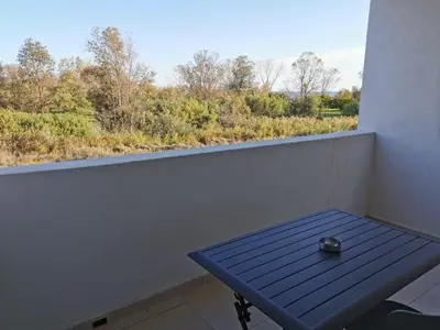 Balcon ou terrasse dans l'établissement marina di bravone - corse - linguizzetta
