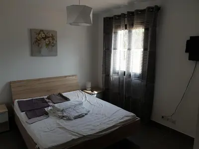 Un ou plusieurs lits dans un hébergement de l'établissement T2 55 m2 4 pers jacuzzi terrasse 55m2