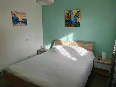 Un ou plusieurs lits dans un hébergement de l'établissement T2 55 m2 4 pers jacuzzi terrasse 55m2