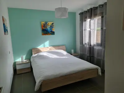 Un ou plusieurs lits dans un hébergement de l'établissement T2 55 m2 4 pers jacuzzi terrasse 55m2