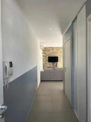 Télévision ou salle de divertissement dans l'établissement Appartement proche de la plage
