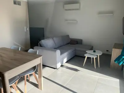 Coin salon dans l'établissement Appartement proche de la plage