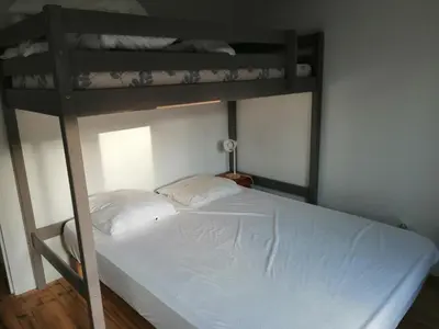 Un ou plusieurs lits dans un hébergement de l'établissement Maison bord de mer climatisée en Corse
