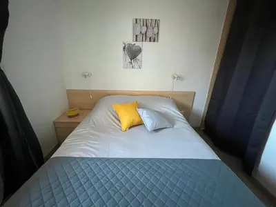 Un ou plusieurs lits dans un hébergement de l'établissement Appartement Jardin de la Mer