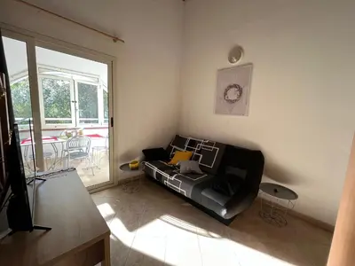 Coin salon dans l'établissement Appartement Jardin de la Mer