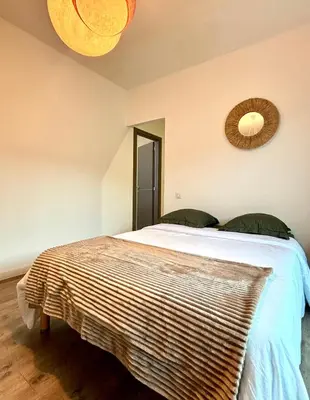 Un ou plusieurs lits dans un hébergement de l'établissement Appartement de Haut Standing Miomo