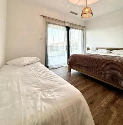 Un ou plusieurs lits dans un hébergement de l'établissement Appartement de Haut Standing Miomo
