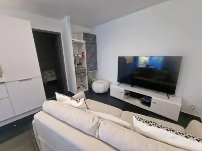Télévision ou salle de divertissement dans l'établissement Appartement a 2 pas de la plage